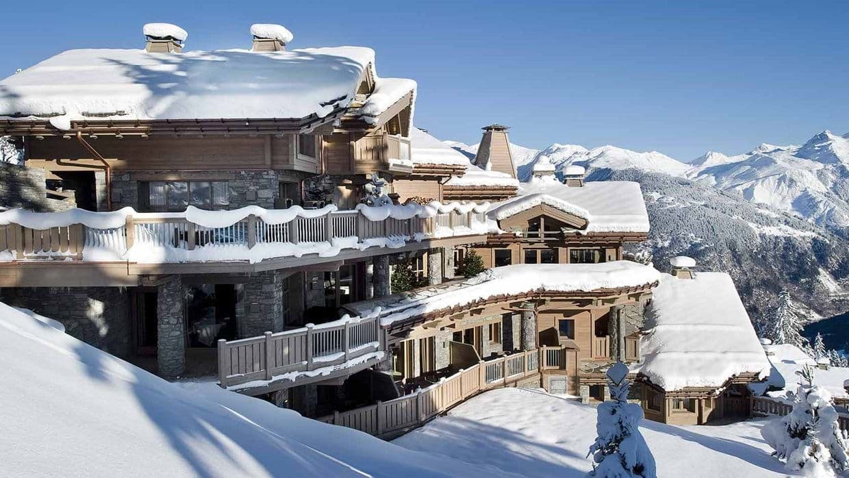 Ski-in/ski-out chalet with multi-level wraparound decks and alpine views