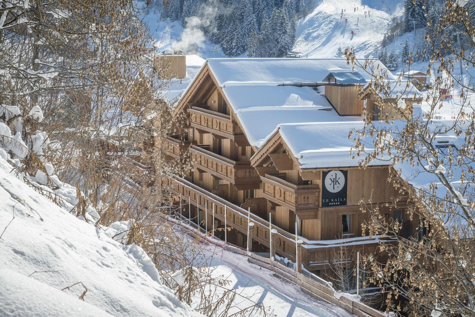 Ski-in, ski-out timber chalet with private balconies overlooking the slopes