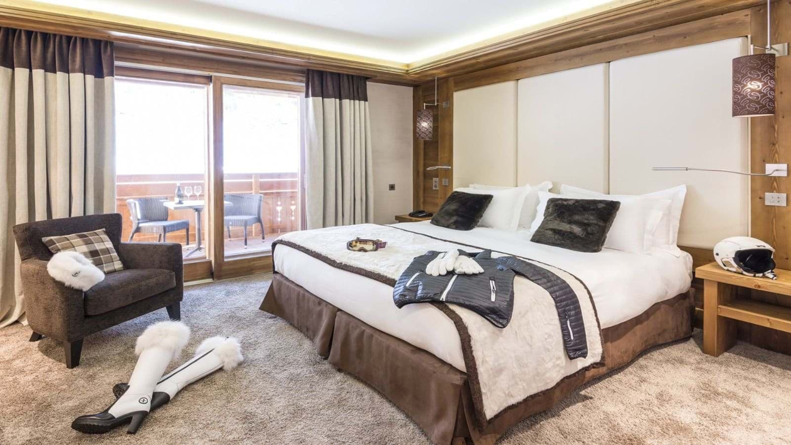 Primary bedroom with king bed and private balcony access