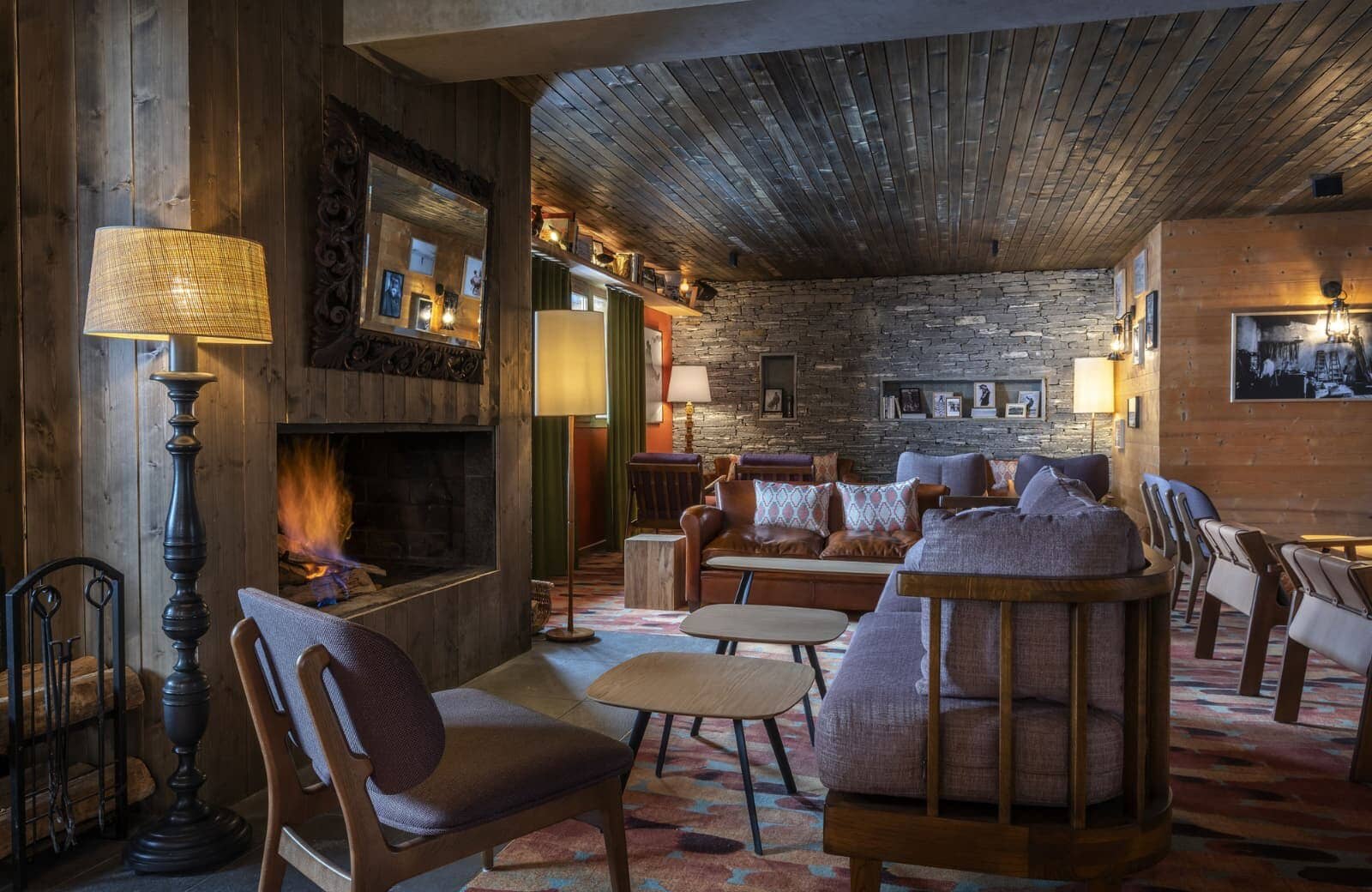 Lounge area with wood-burning fireplace and ample sofa seating