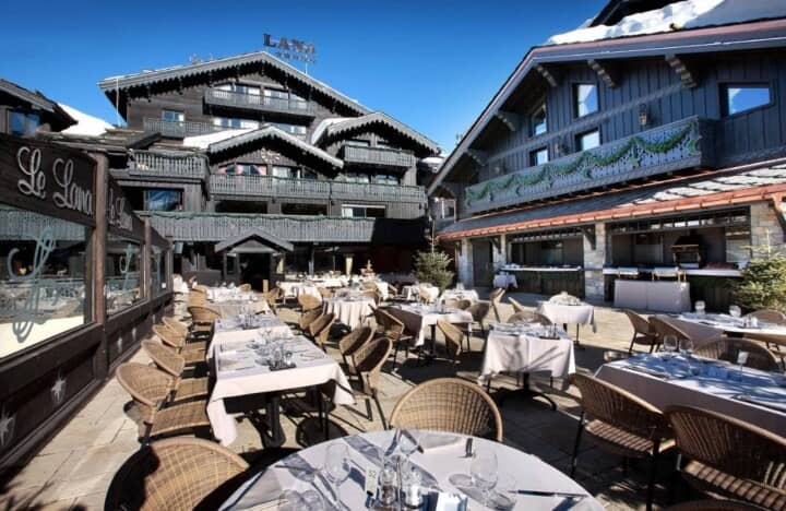 Outdoor terrace restaurant at Le Lana; ski-in/ski-out access via Bellecôte piste