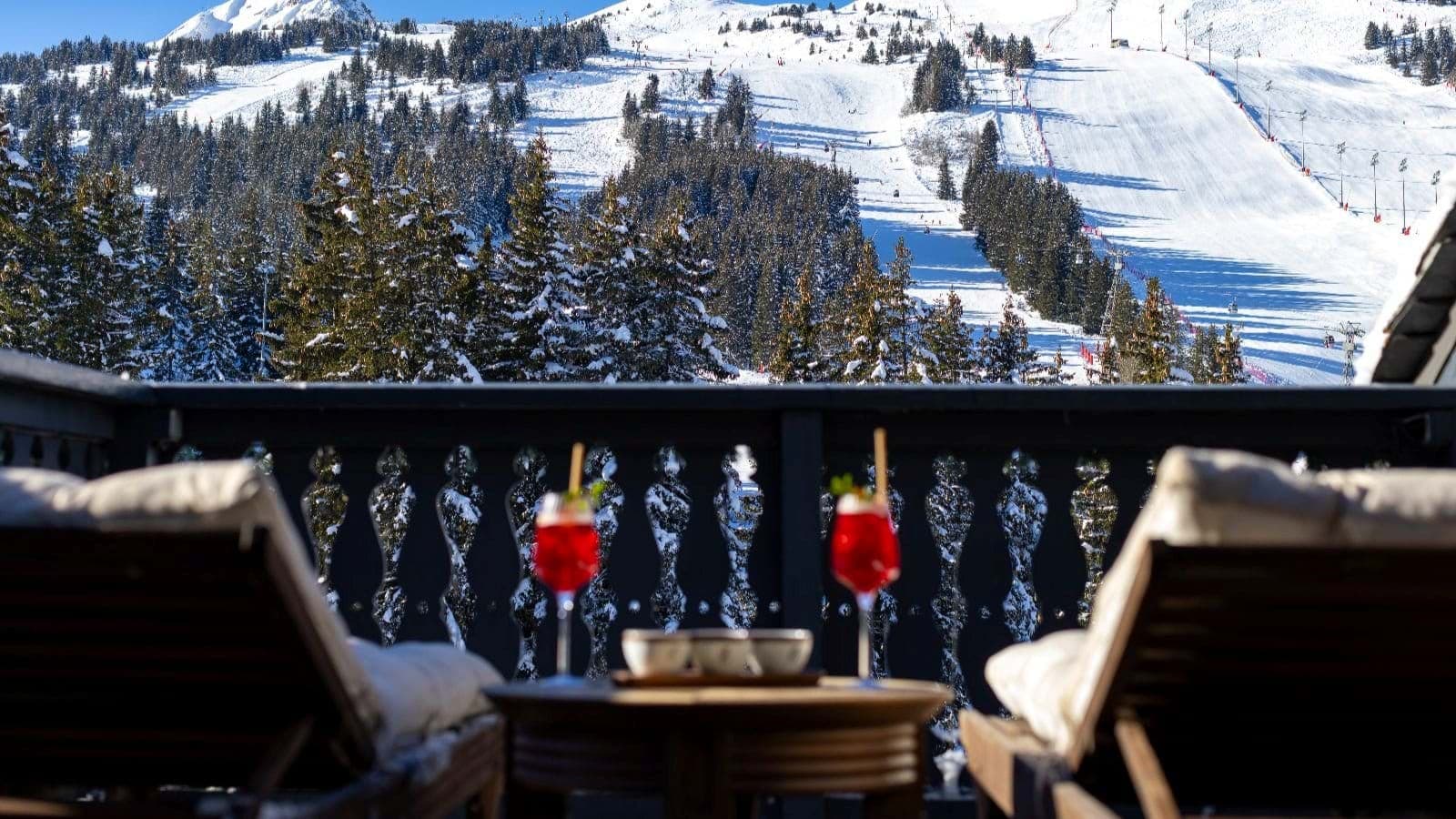 Private balcony with lounge seating and ski-in/ski-out mountain views