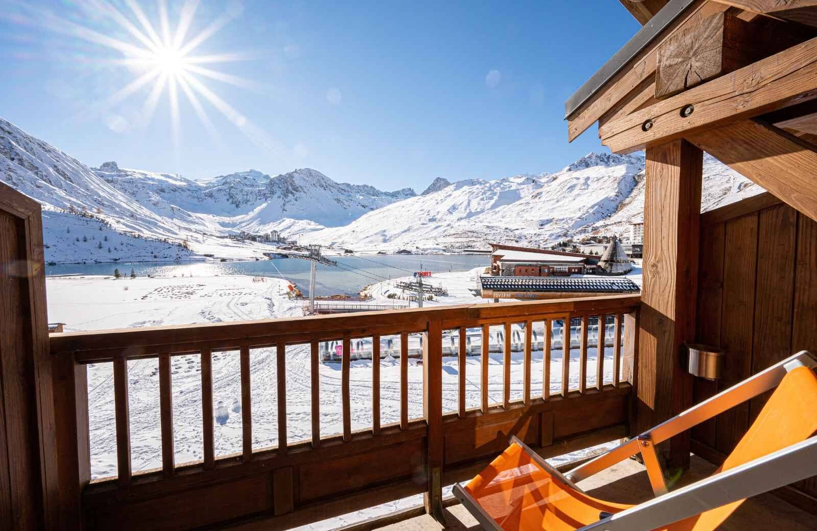 Balcony with mountain and lake views; includes lounge seating