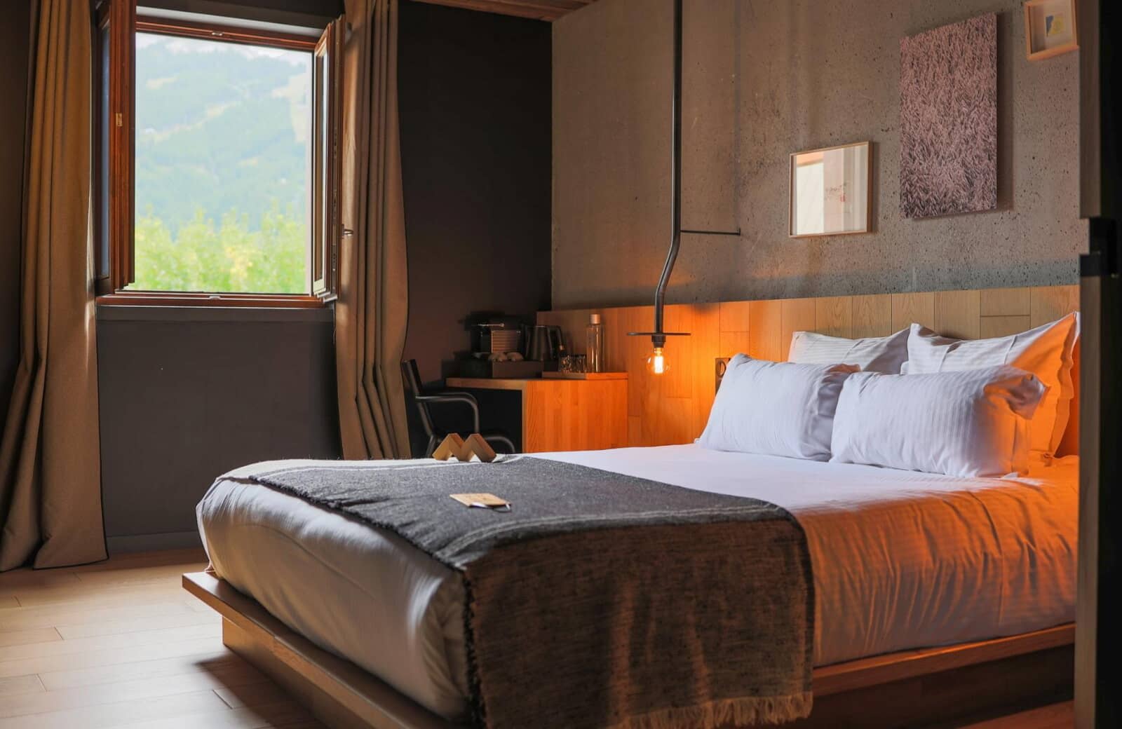 Bedroom with king bed, desk workspace, and mountain views