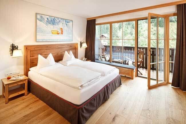 Bedroom with Austrian twin bed and private balcony access