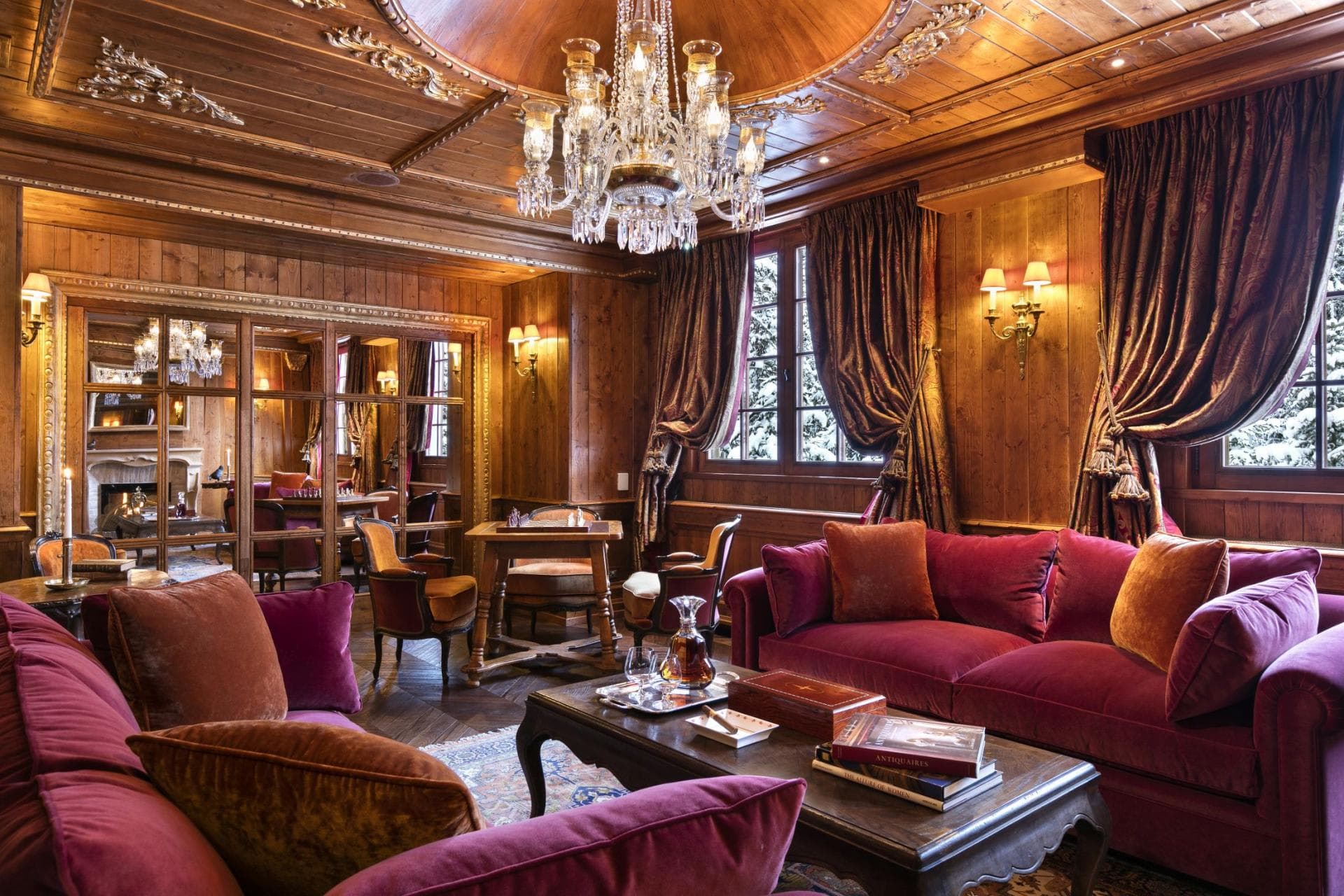 Wood-paneled lounge with velvet seating and dedicated chess table
