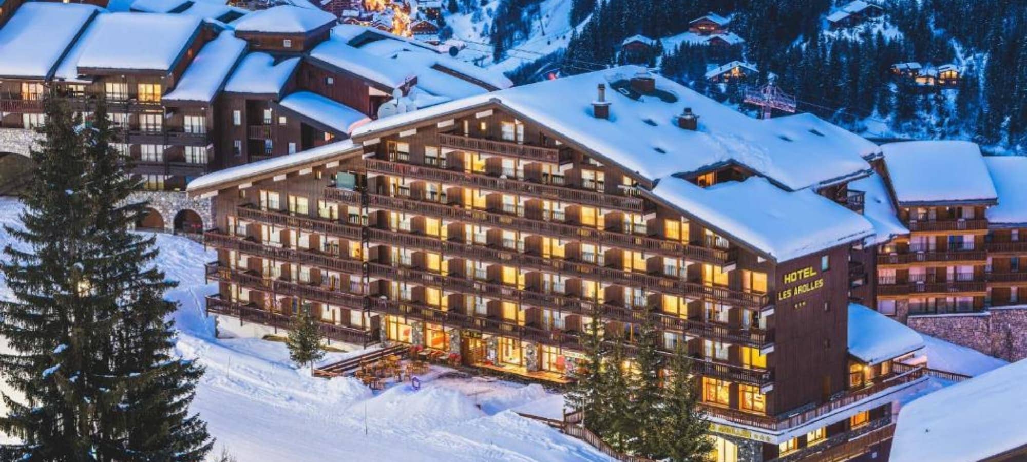 Ski-in, ski-out chalet hotel exterior with private balconies and mountain views