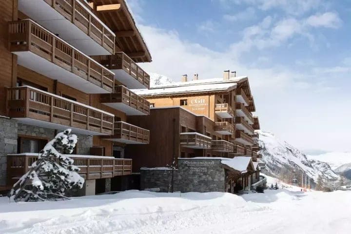 Ski-in/ski-out residence exterior with private balconies and mountain views