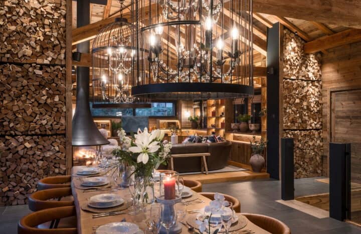 Open-plan dining area featuring wood-burning fireplace and seating for 10