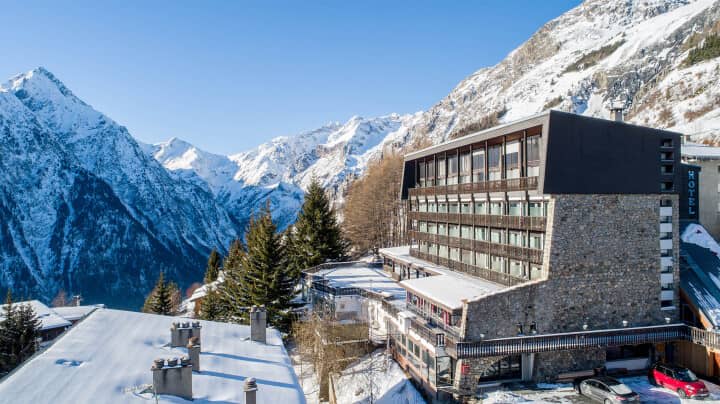Ski-in/ski-out hotel exterior with south-facing balconies and mountain views