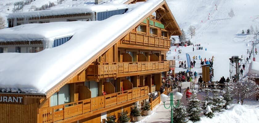 Ski-in ski-out chalet with private balconies overlooking the main run