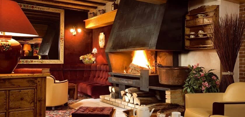 Lounge with wood-burning fireplace and banquette seating