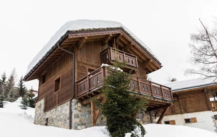 Ski-in chalets with private balconies and stone-clad foundations