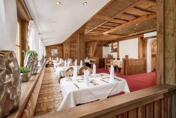 Dining room with booth seating and traditional wood paneling
