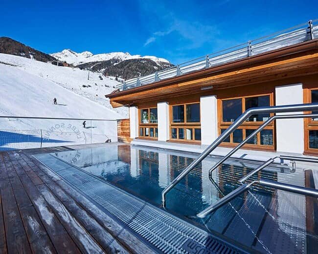 Outdoor heated pool and terrace with ski-in/ski-out access