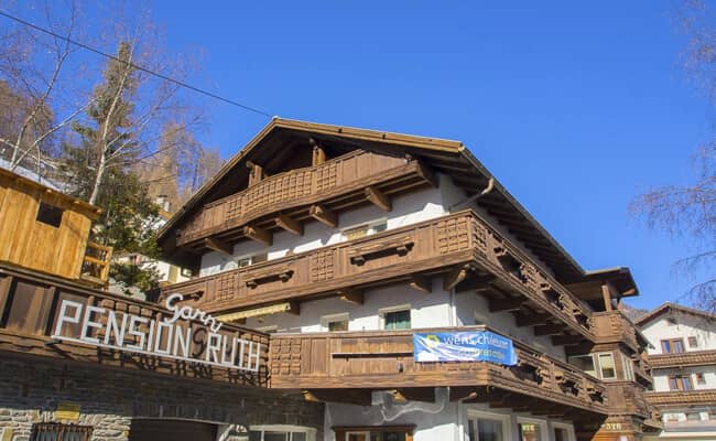 Chalet exterior with multiple private balconies and timber architecture
