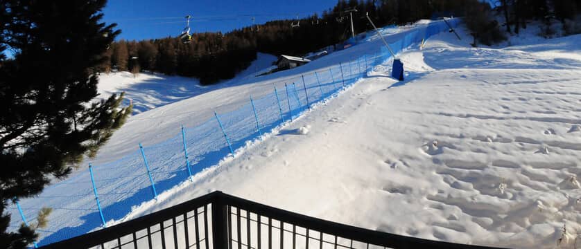 Balcony view of ski-in/ski-out access and chairlift