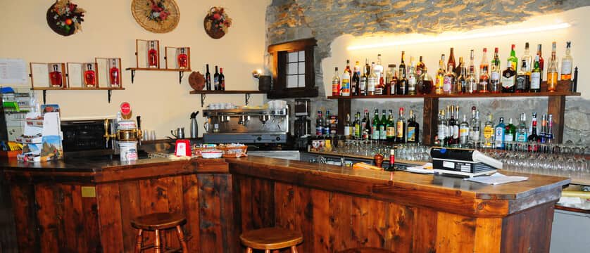 Private bar with espresso machine, draught tap, and full liquor selection