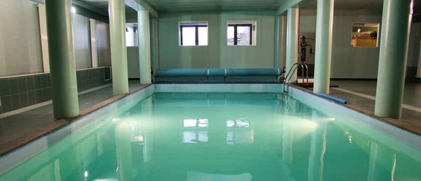 Indoor heated pool with underwater lighting and thermal cover