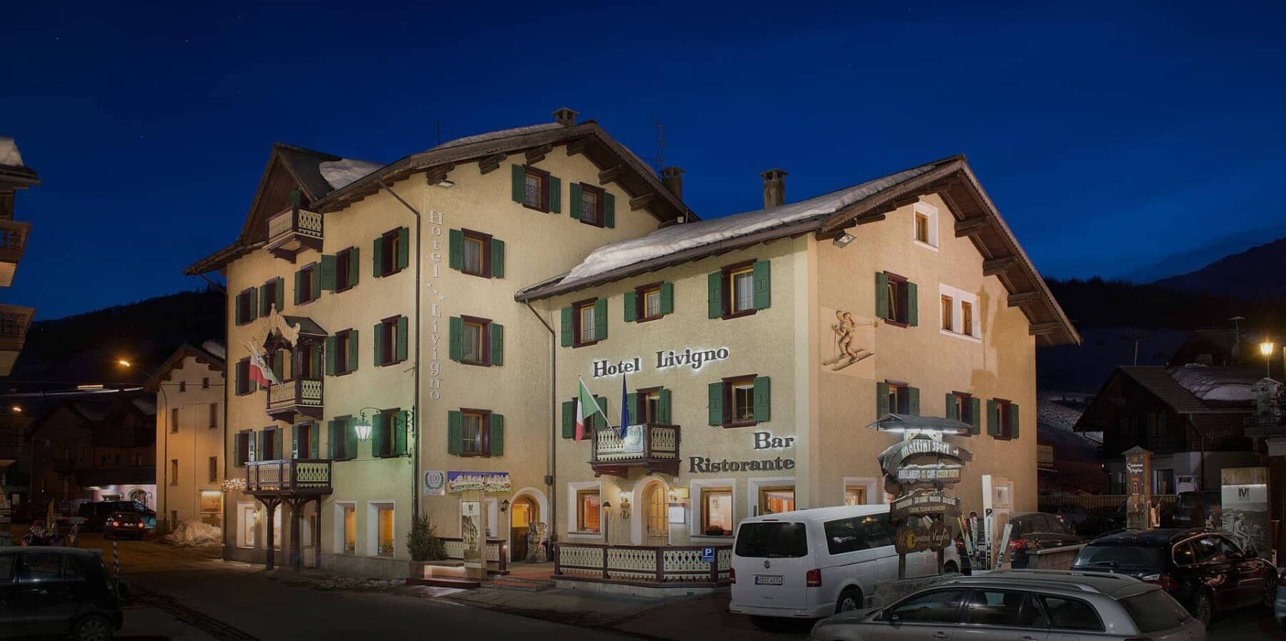 Hotel Livigno exterior featuring on-site restaurant and guest parking