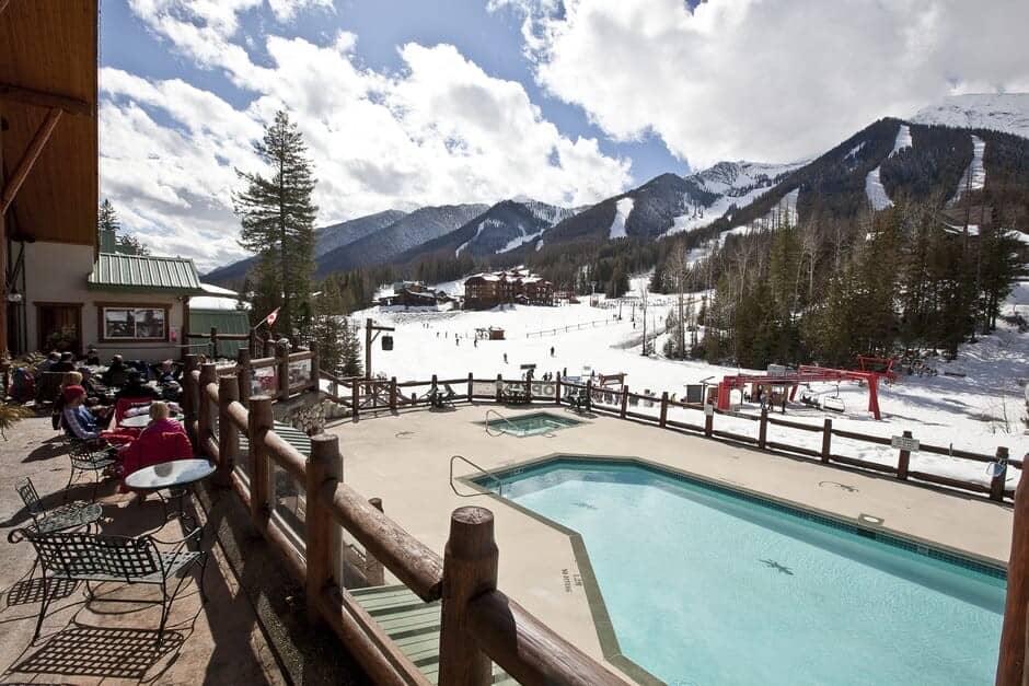 Shared pool and hot tub area with ski-in/ski-out access
