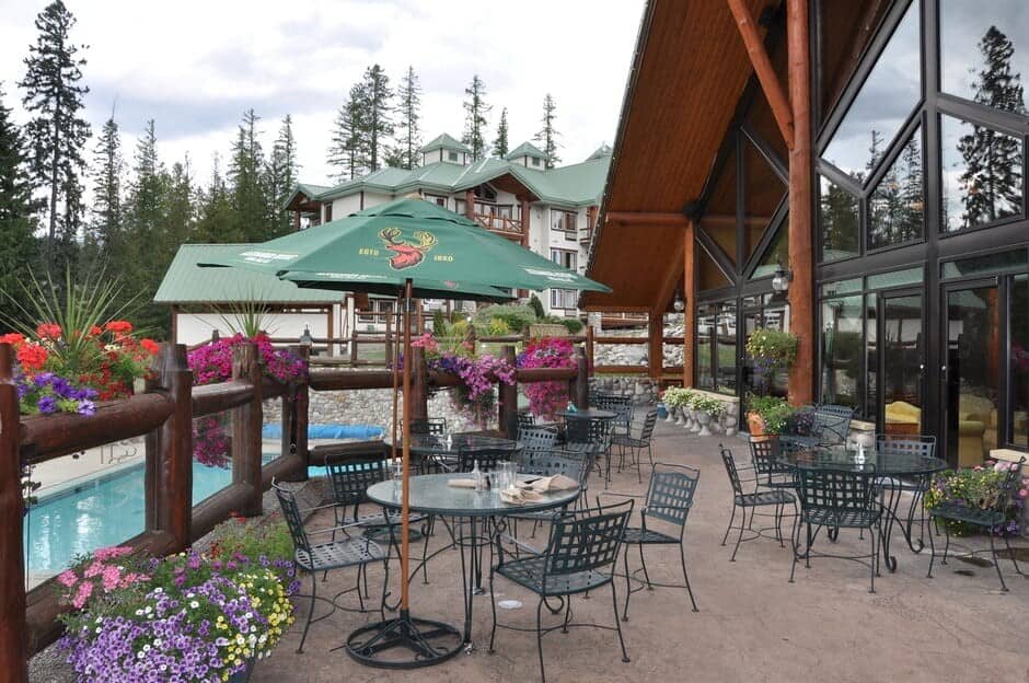 Shared patio with cafe seating overlooking the heated outdoor pool