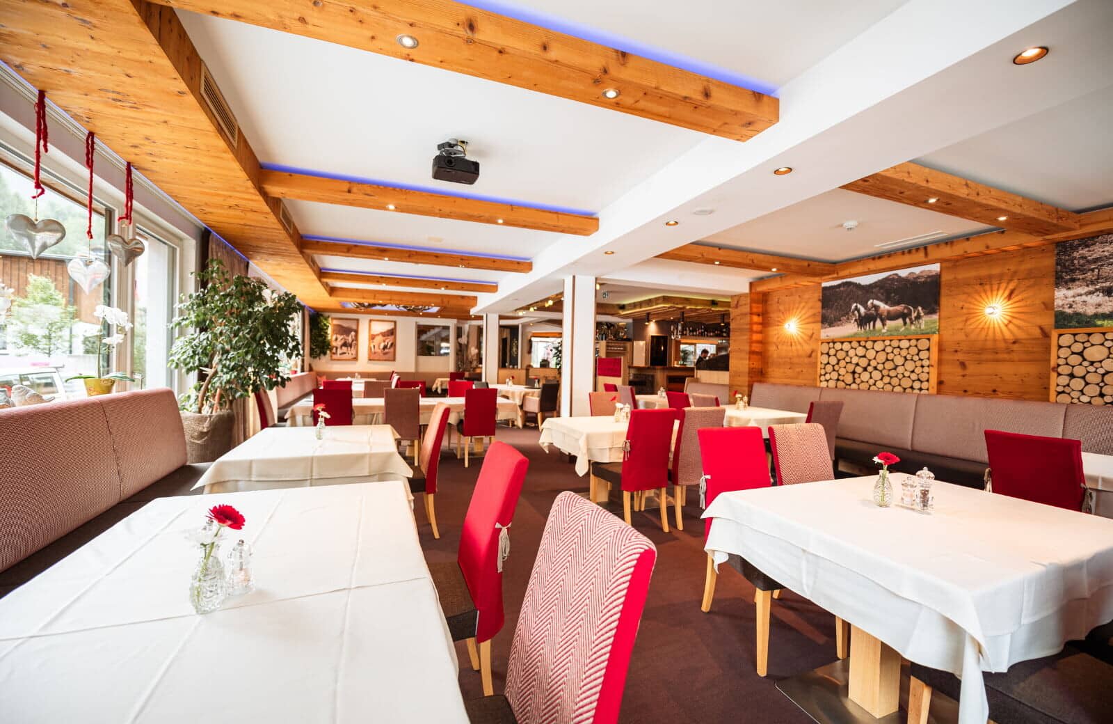 Dining room with projector and banquet seating for large groups