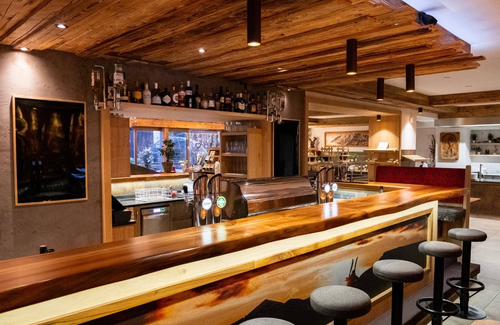 Entertainment bar with draft beer taps, espresso machine, and seating for four