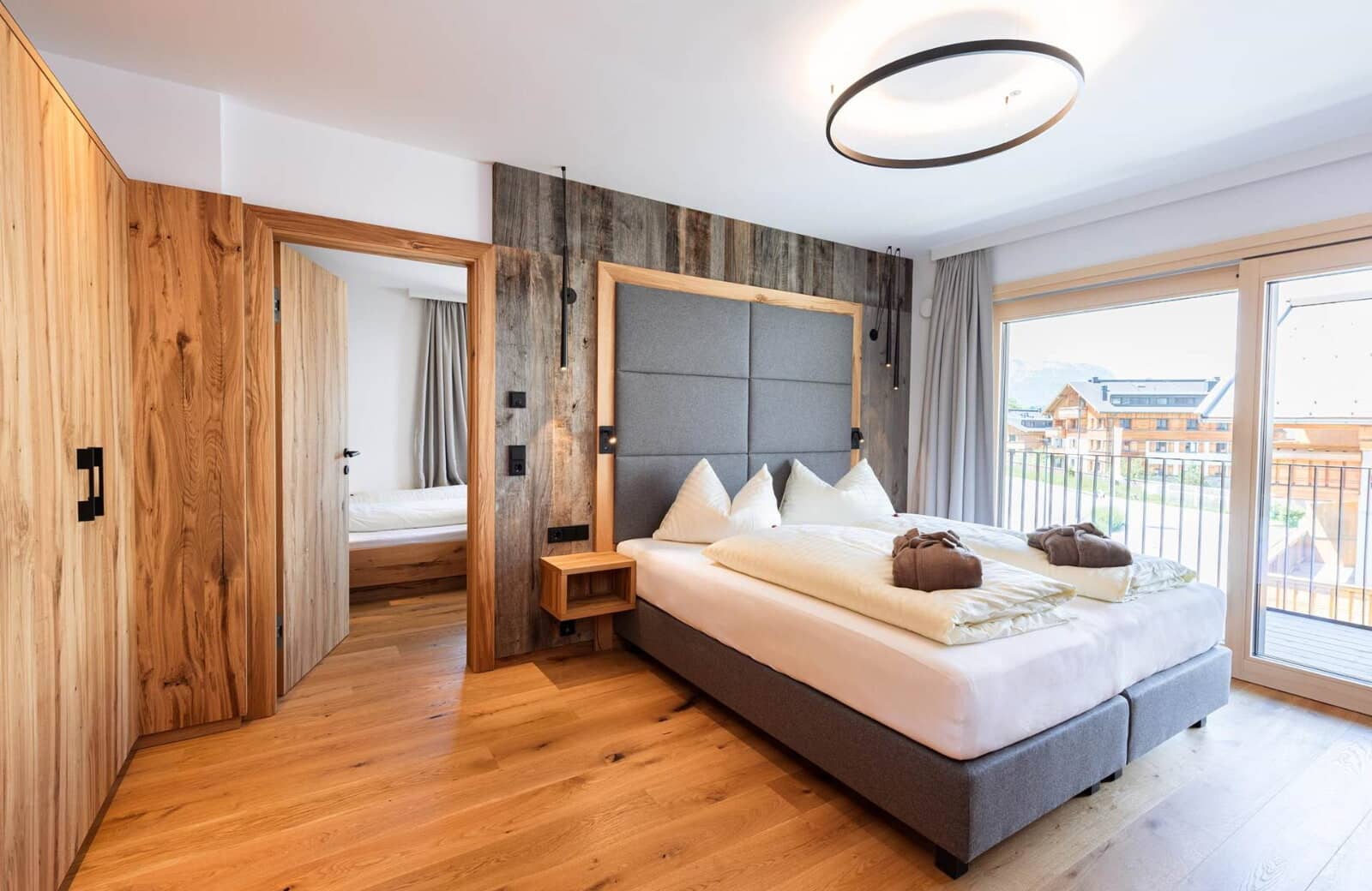 Primary bedroom with balcony access and adjoining guest room