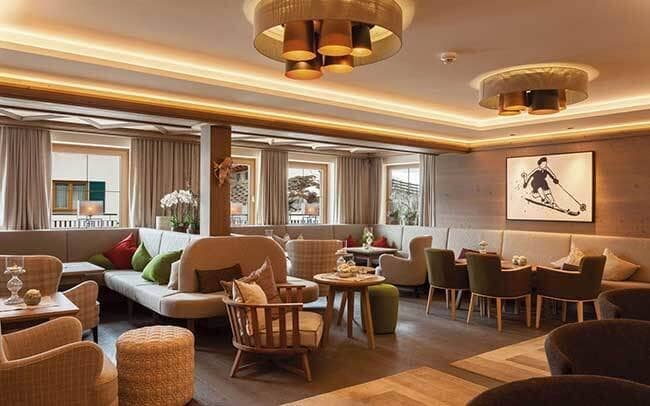 Shared lounge area with banquette seating and café tables