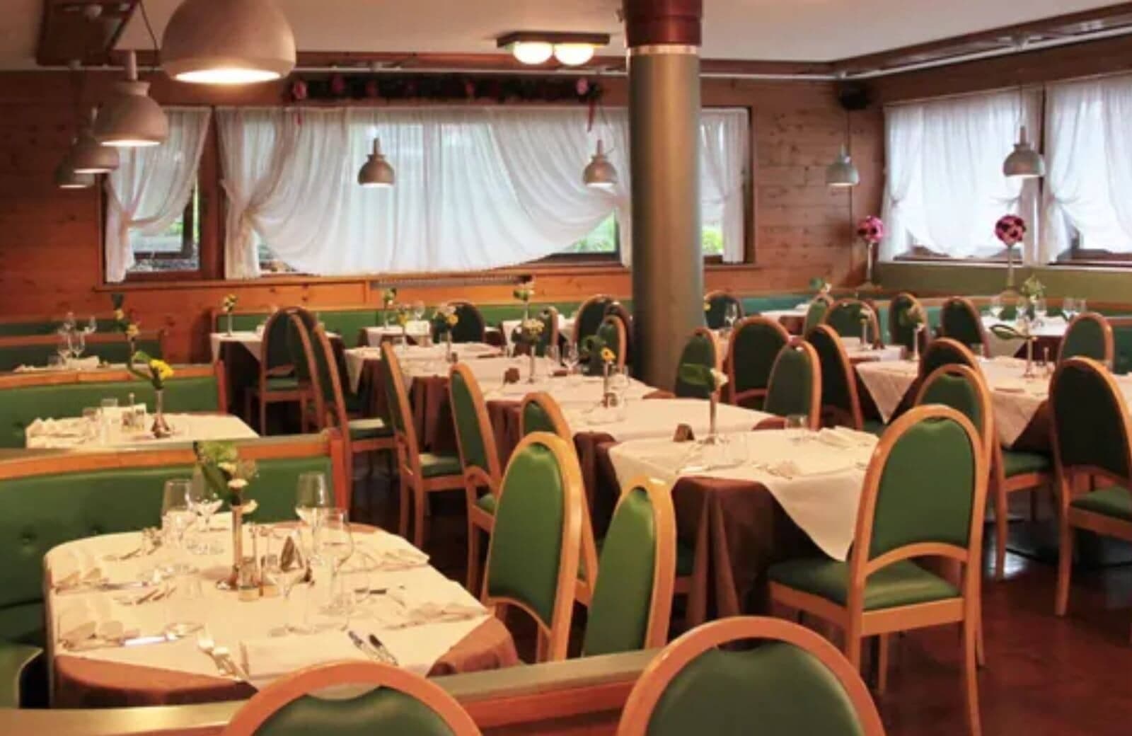 Dining room with booth seating and tables for large groups