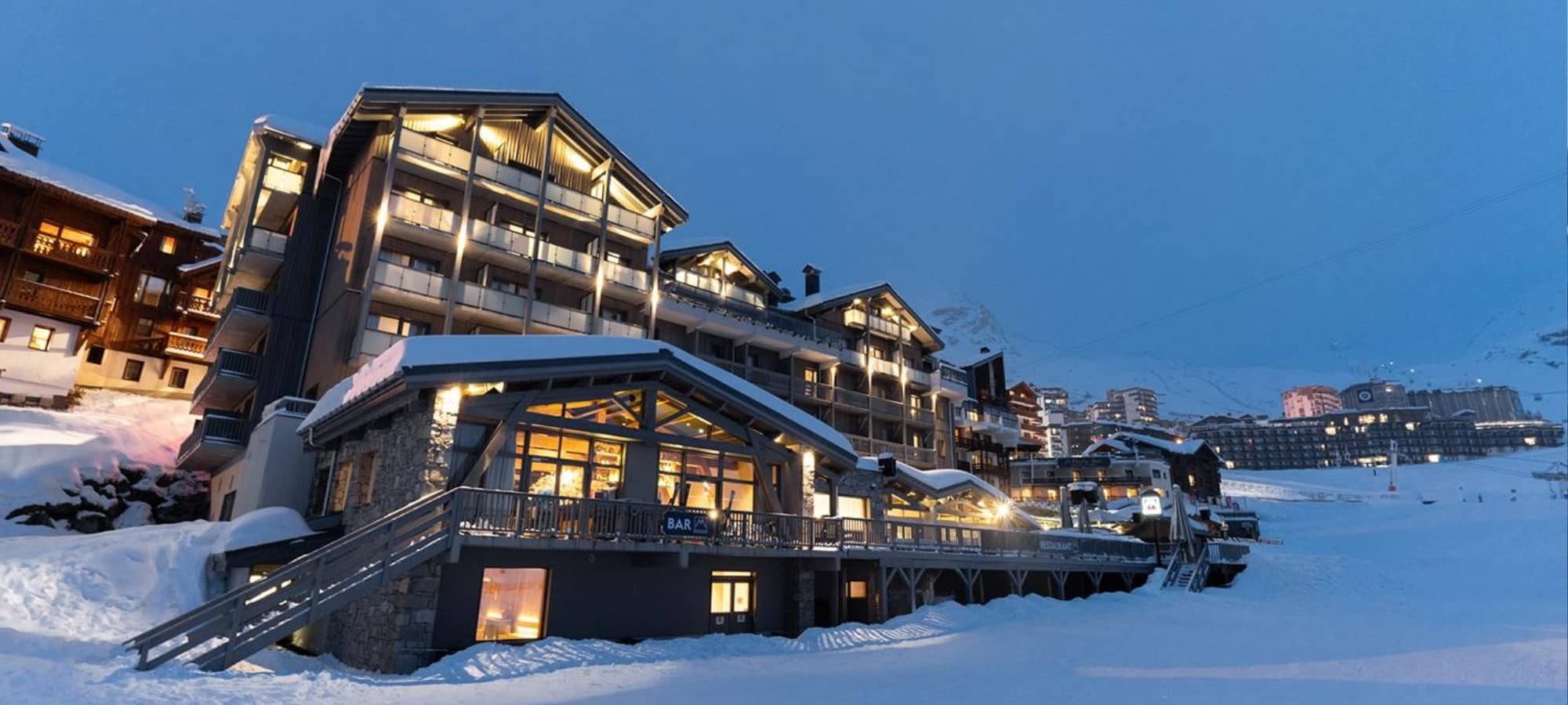 Ski-in/ski-out chalet exterior with private balconies and onsite restaurant