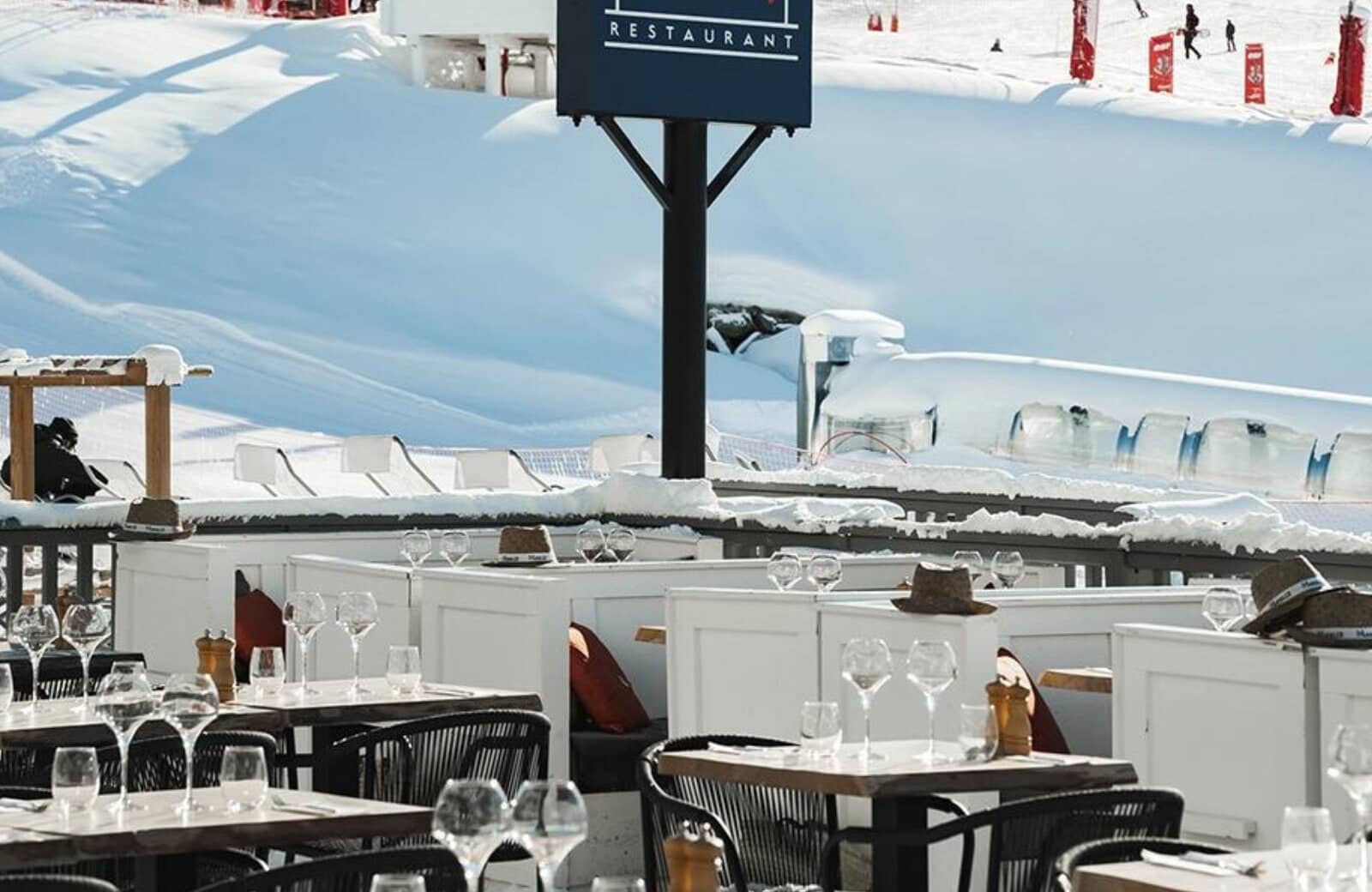 Ski-in dining terrace with slopeside views and booth seating