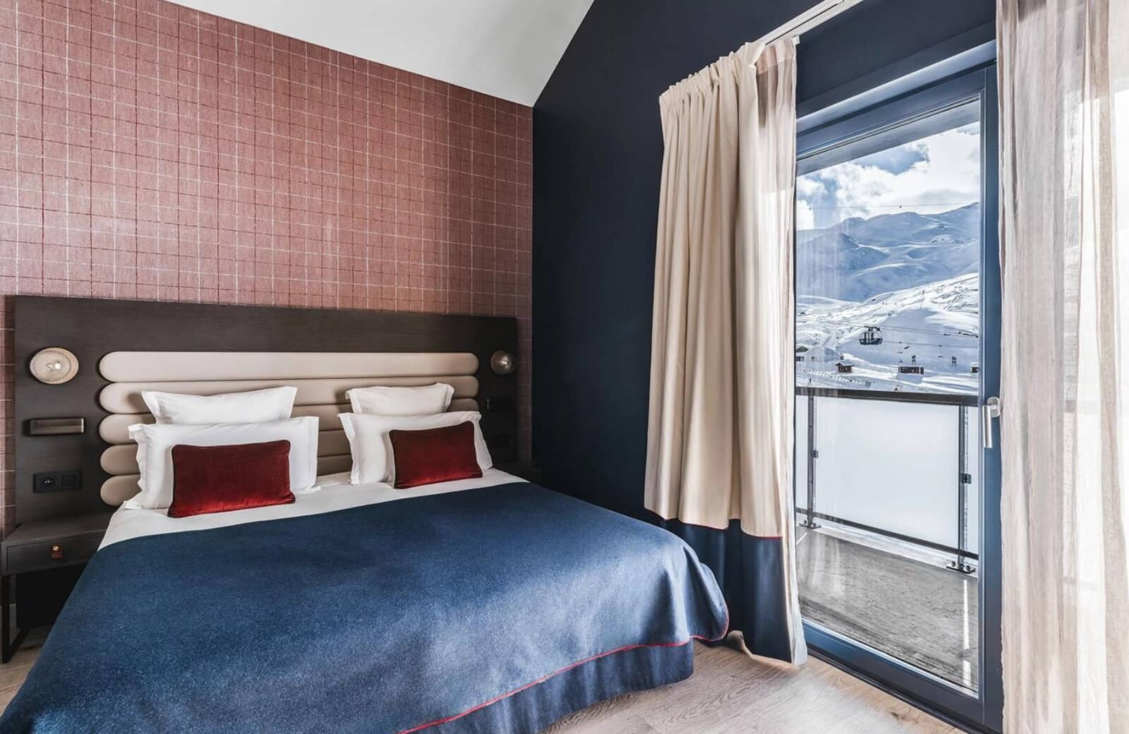 Bedroom with king bed and mountain-facing balcony access