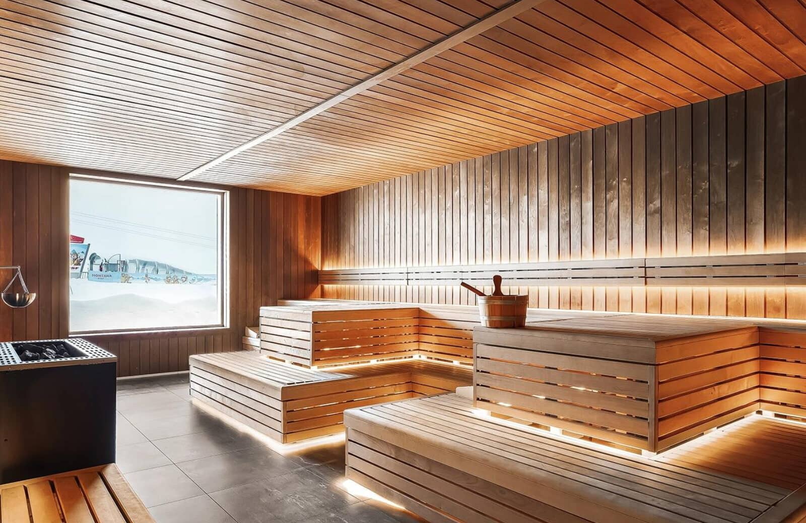 Cedar sauna with tiered seating and views of the ski slopes