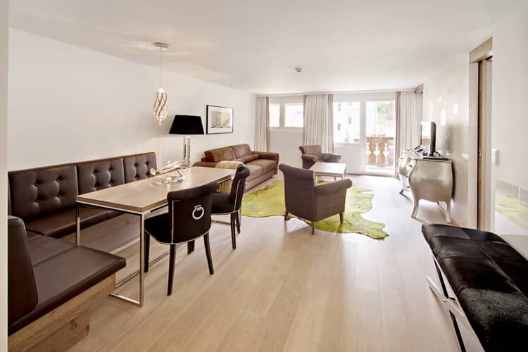 Open living area with banquet dining and private balcony access