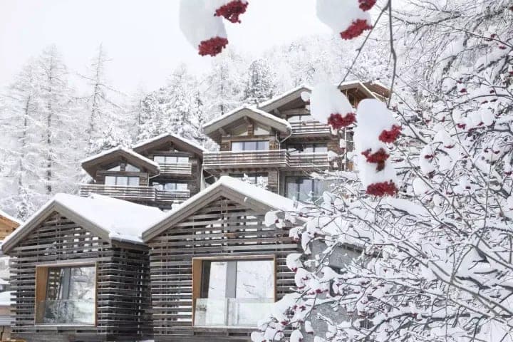 Ski-in/ski-out timber chalet with private balconies and mountain views
