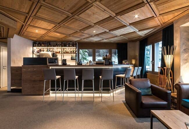 Private bar area with seating for 7 and coffered wood ceiling