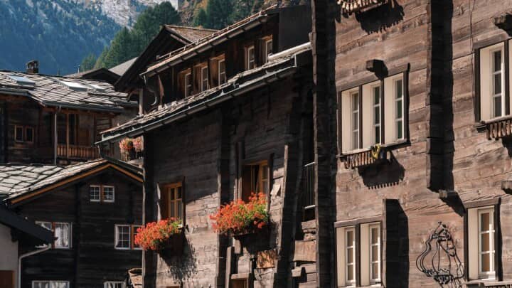 Traditional timber chalets with flower boxes and mountain views