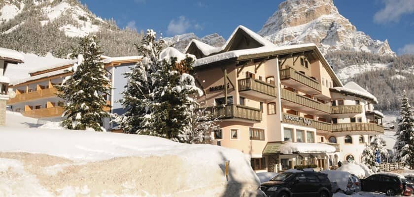 Ski-in/ski-out lodge exterior with private balconies and mountain views