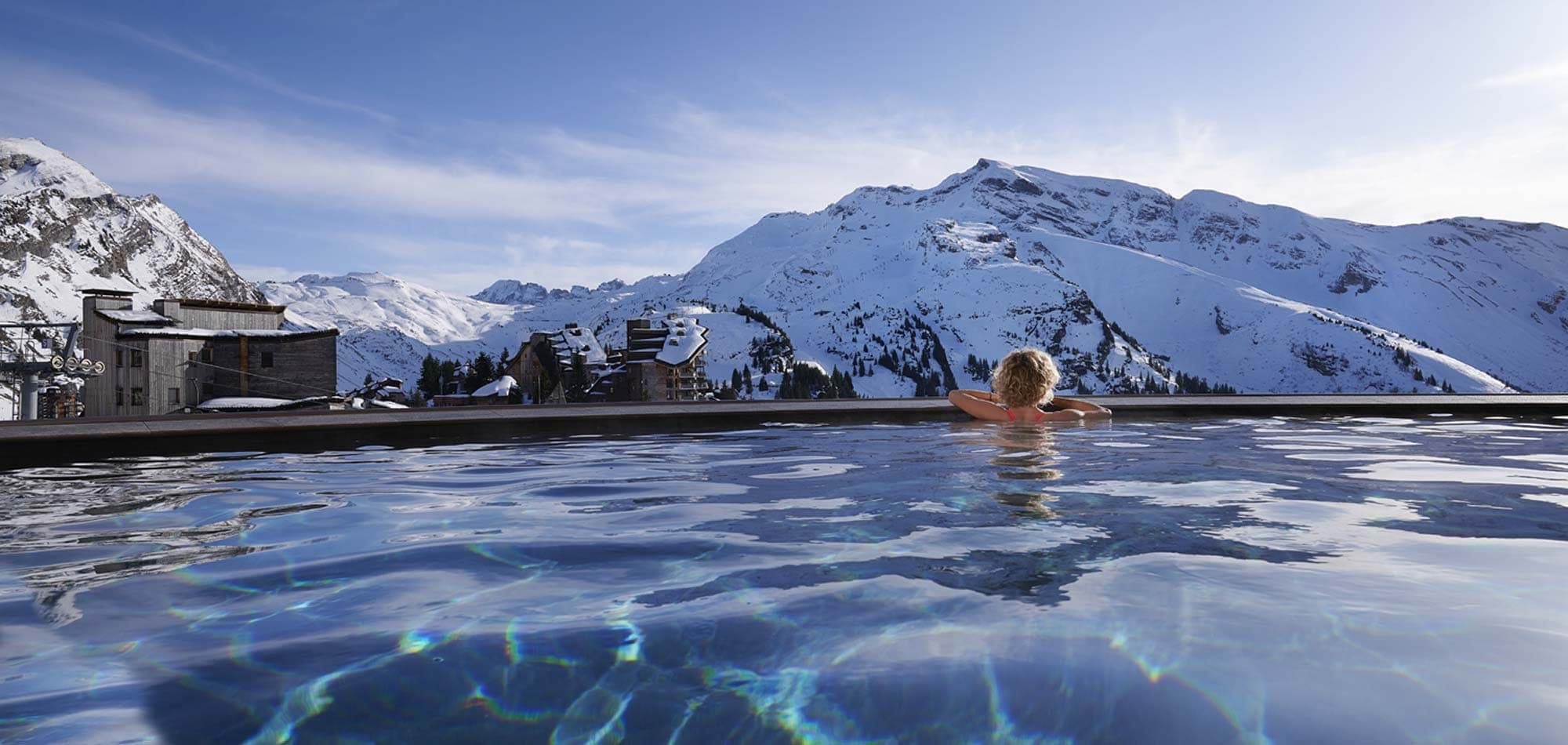 Heated outdoor infinity pool with panoramic mountain views