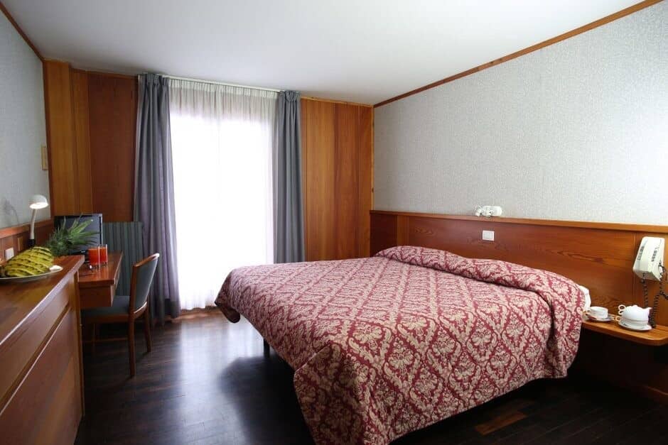 Guest bedroom with king bed and built-in desk workstation