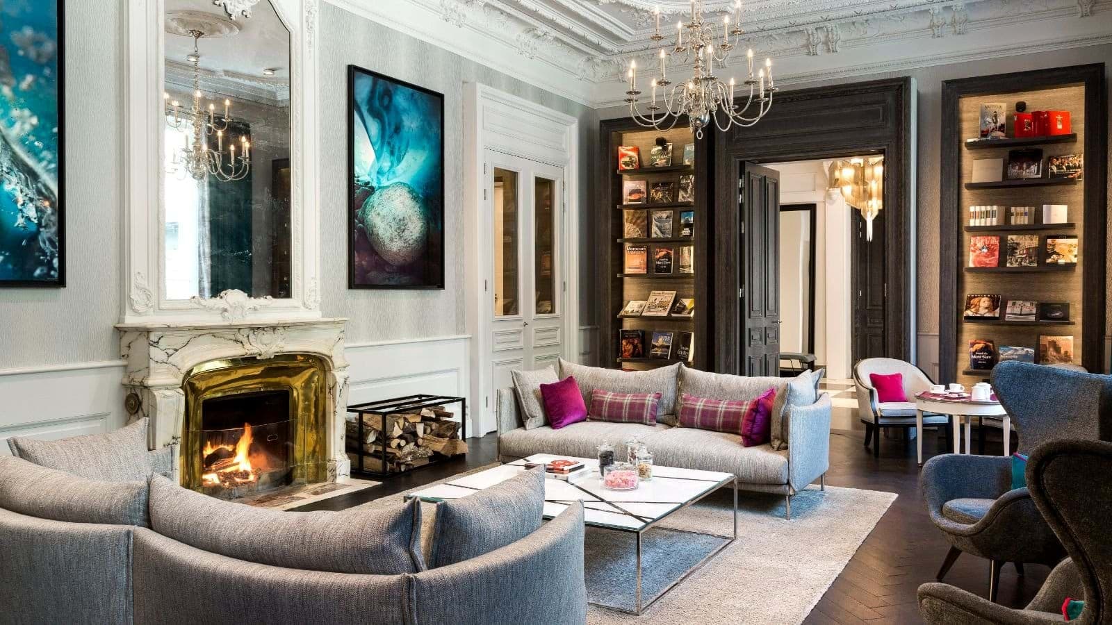 Living room with wood-burning fireplace and original crown molding