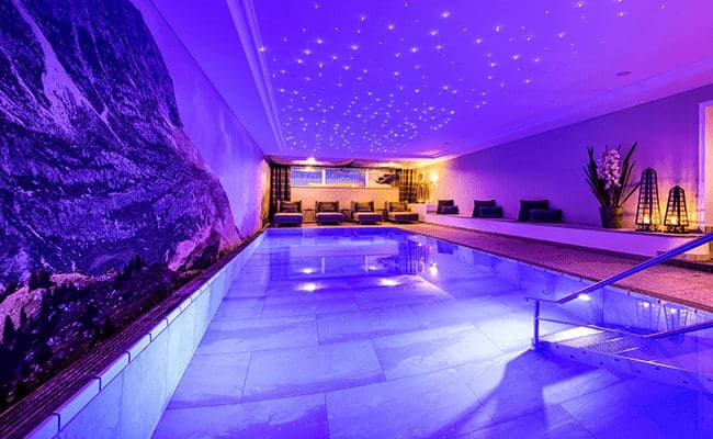 Indoor pool with fiber optic star ceiling and mountain mural