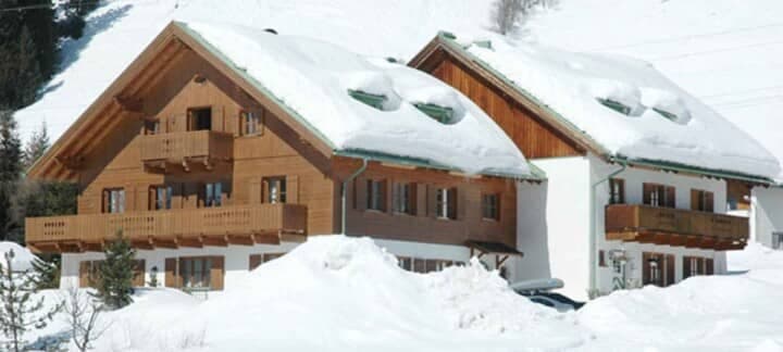 Ski-in chalet with private balconies and mountain views