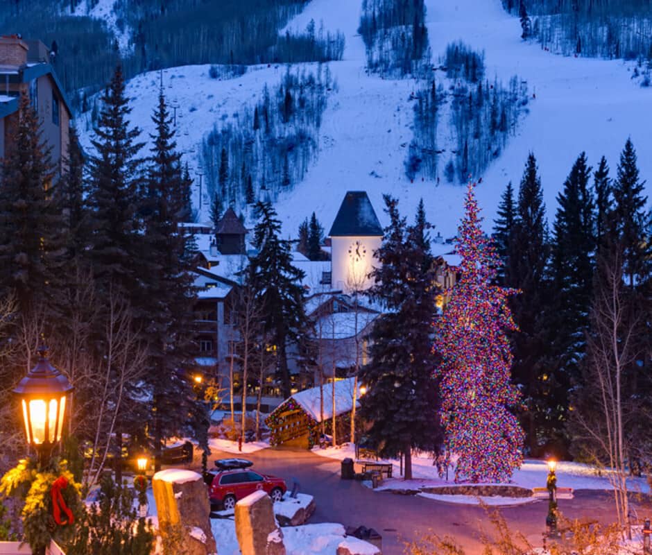 Vail Village view with illuminated clock tower and adjacent ski slopes