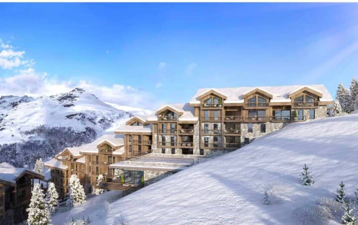 Ski-in/ski-out chalet with private balconies and mountain peak views