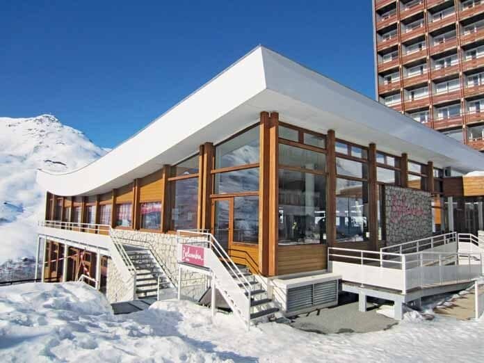 Ski-in lounge and restaurant entrance with floor-to-ceiling windows