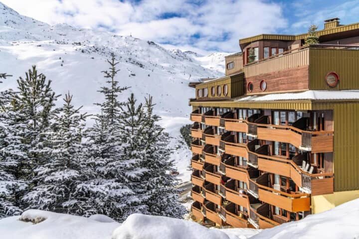 Ski-in/ski-out apartment building with private balconies and mountain views