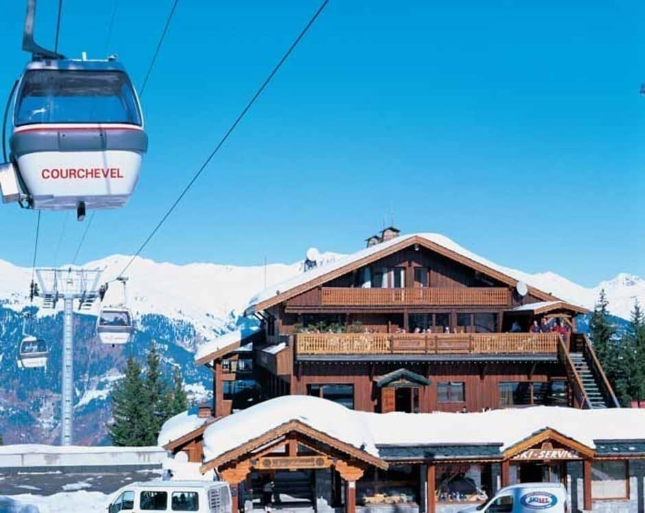 Chalet exterior with multiple balconies located beside the Courchevel gondola